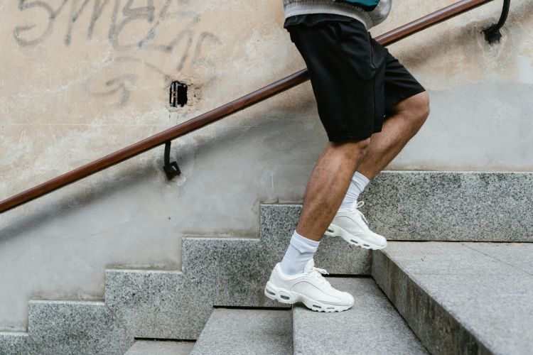 Photo of a person running up stairs.