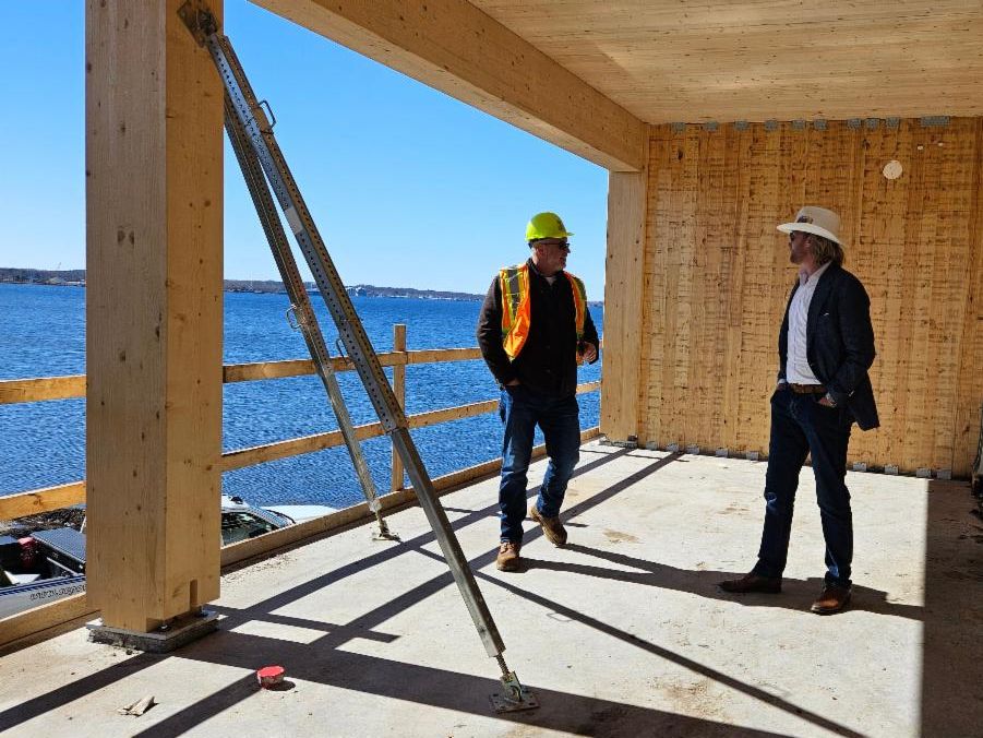 Construction manager and developer on a mass timber building worksite.