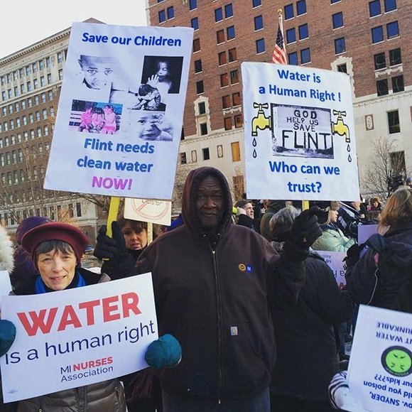 People protesting with signs.