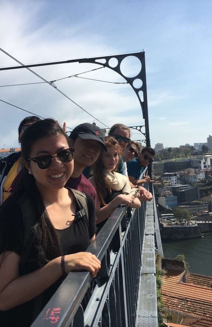 Students standing on a bridge in Lisbon.