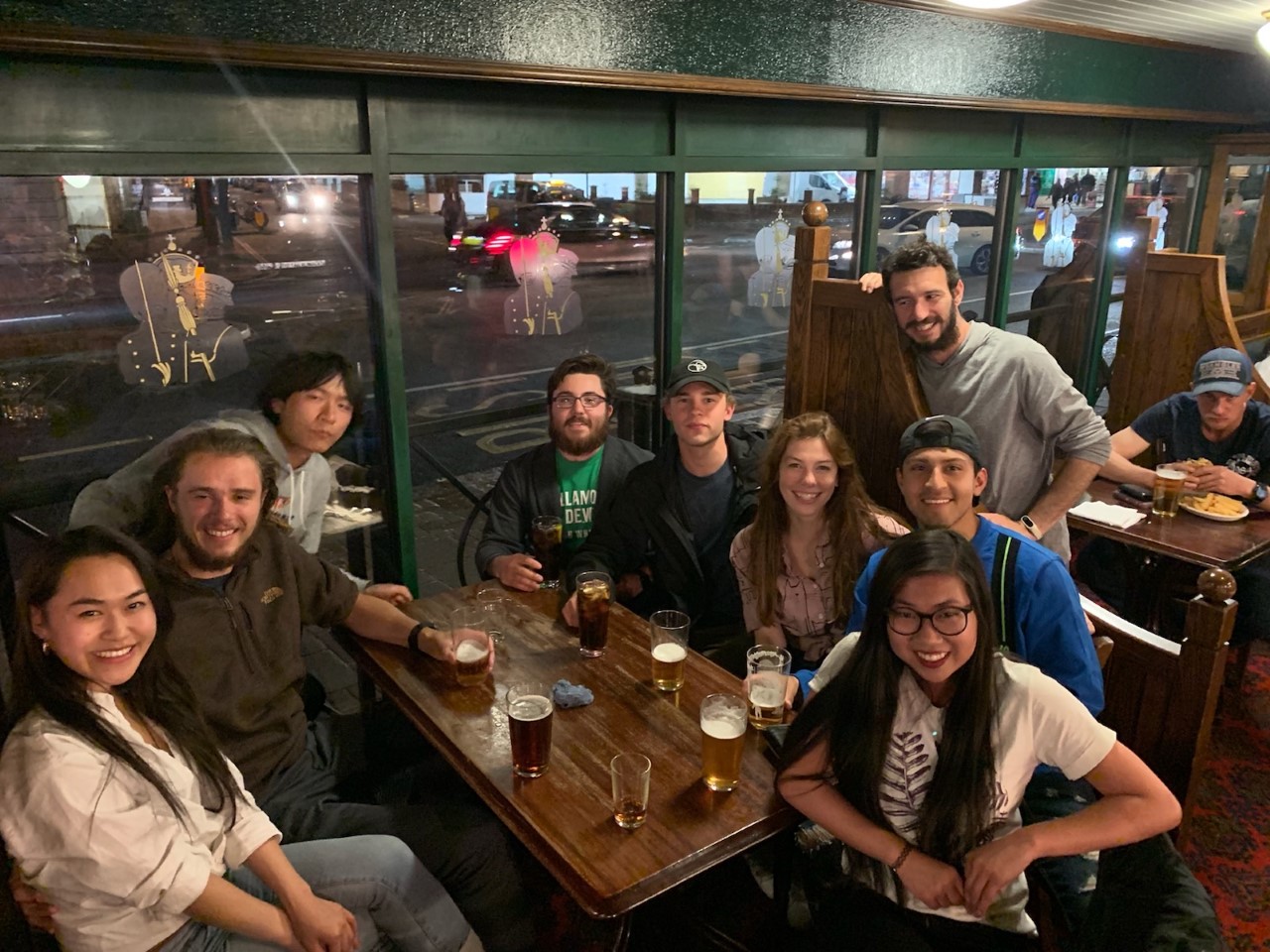 Group shot of students sitting at a table in a restaurant.