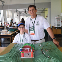 Grandchild and grandparent show off their stadium design