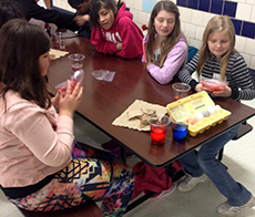 Youth decorating Easter eggs